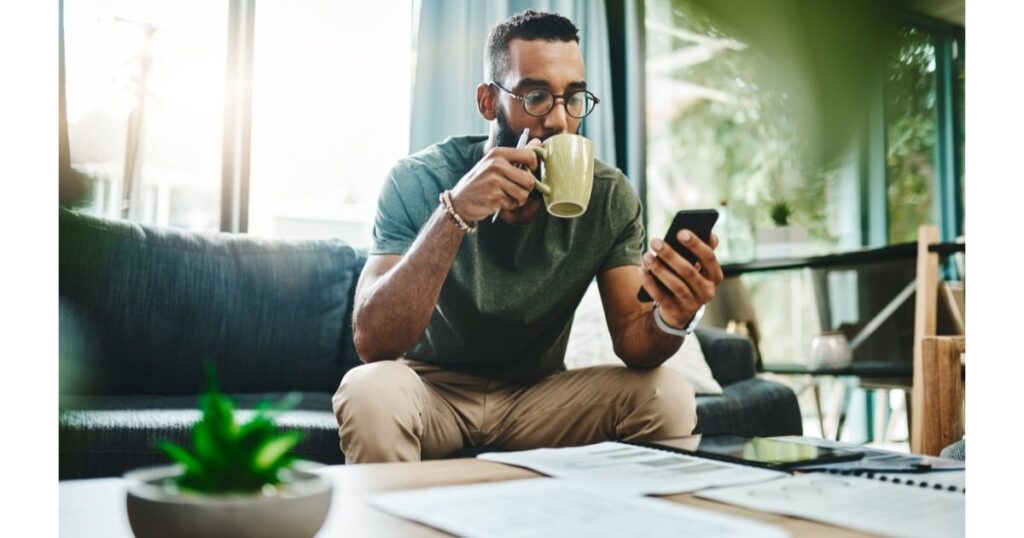 african american male using app on smartphone