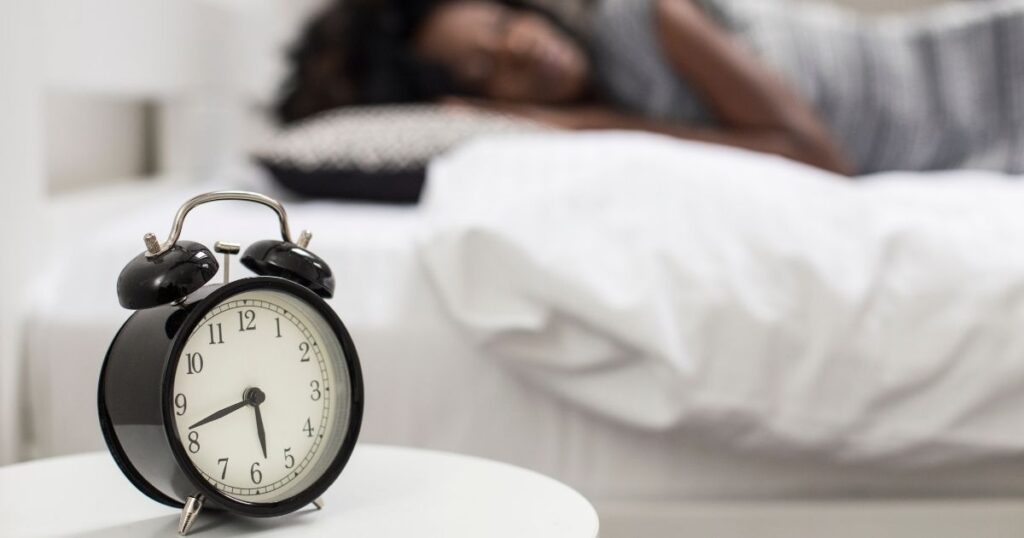 alarm clock on bedside table