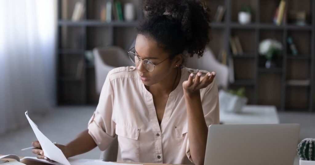 millennial woman looking at document